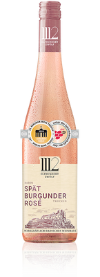 Eine Flasche Spätburgunder Rosé aus Baden, elegant mit einem zarten rosa Farbton und feinen Blasen auf der Oberfläche.